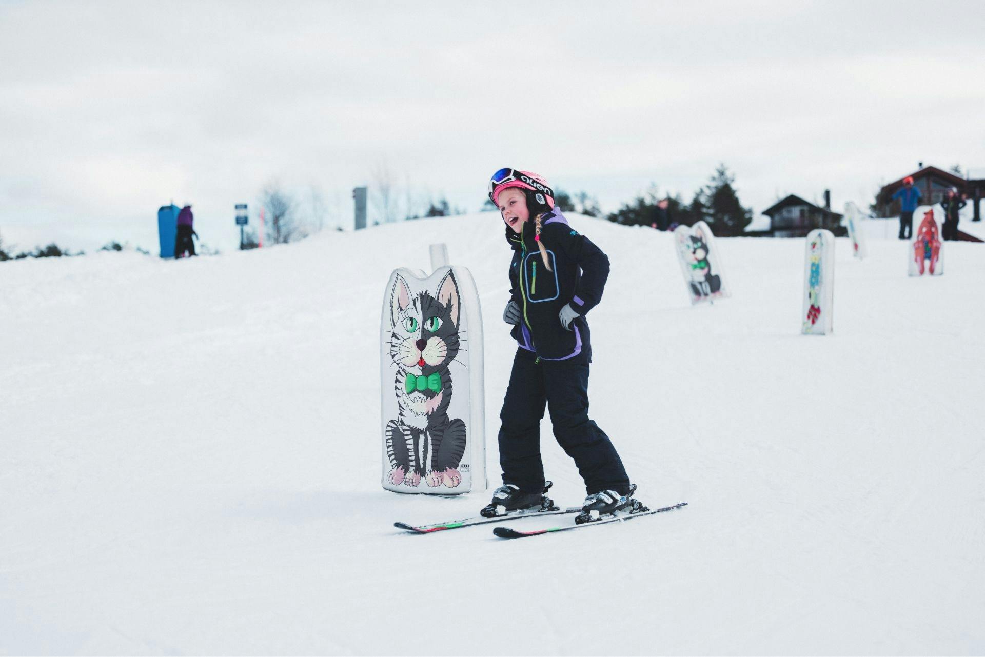 Girl skiing in childrens area