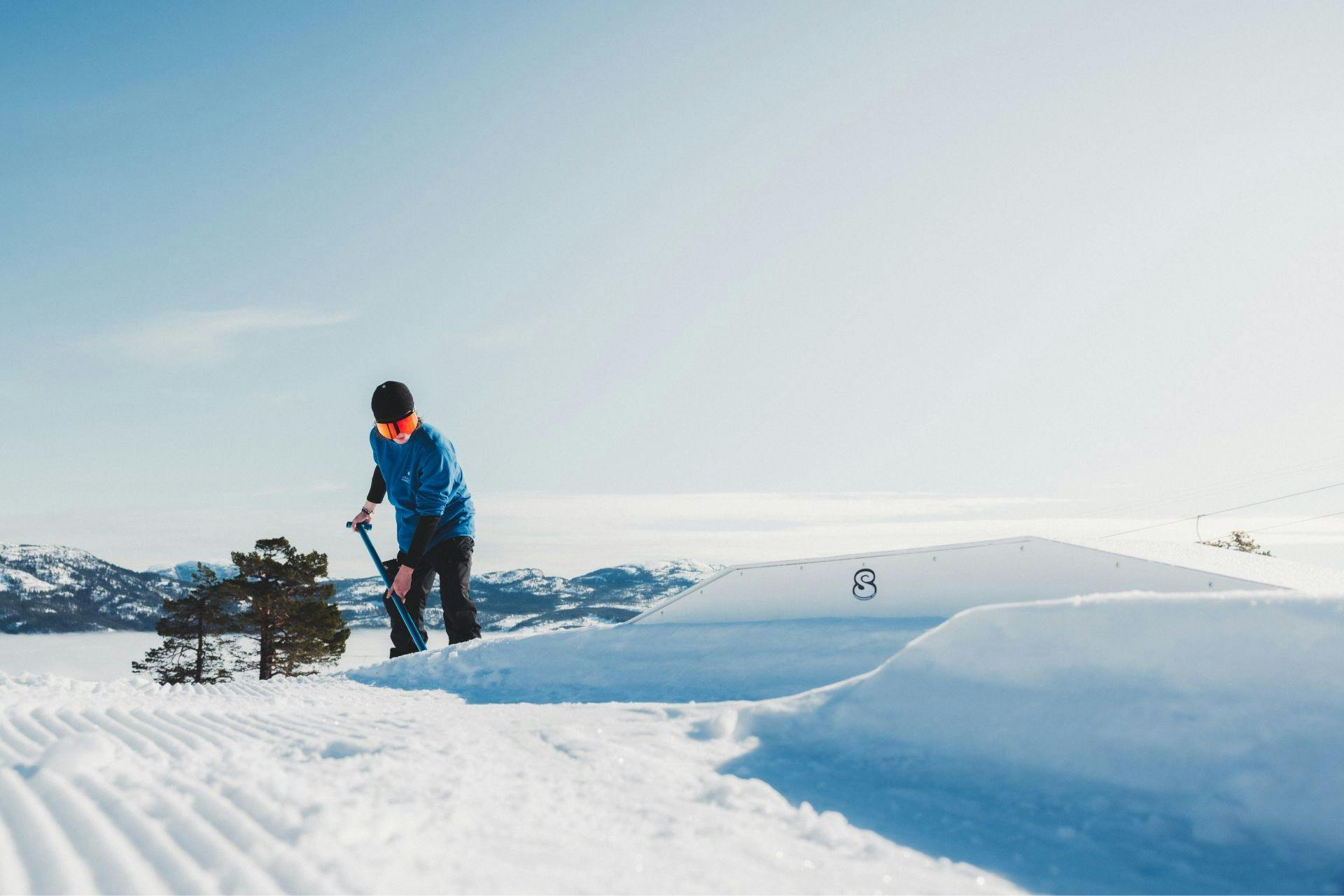 Man shaping snowpark